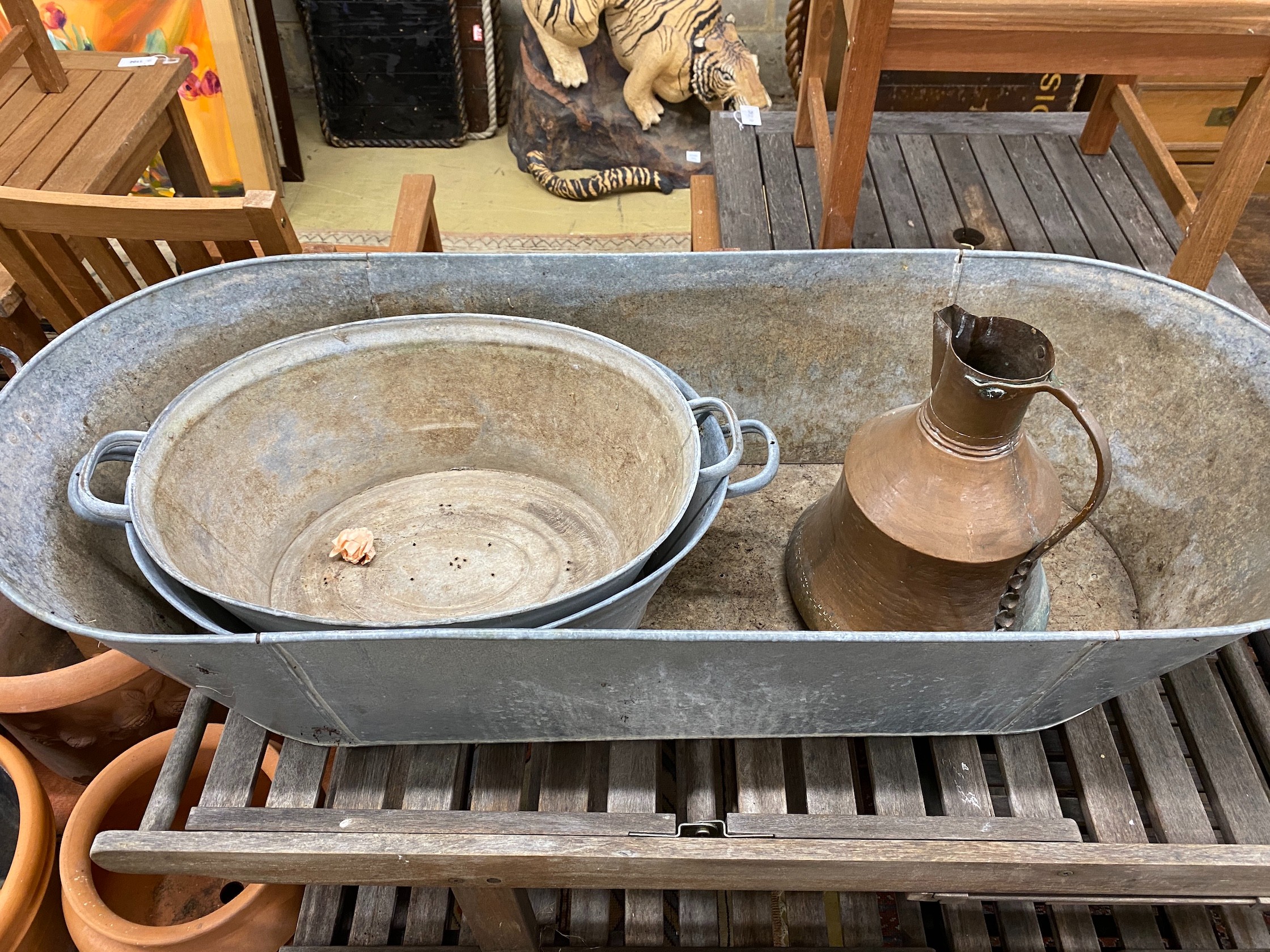 Three oval galvanised containers and a Turkish copper pot, largest length 135cm